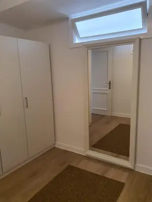 an empty room with a window and a door at Apartamento casco viejo in Ourense