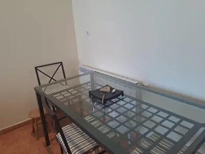 a glass table with a bag on top of it at EnFOZ PLAYA PISCINA Y PARKING in Foz