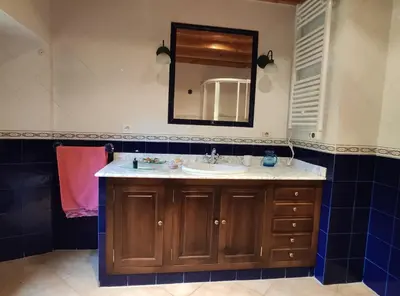 a bathroom with a sink and a mirror at Casa Moucheiro in Lugo