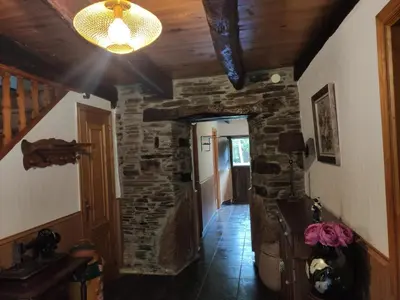 a hallway in a house with a stone wall at Casa Moucheiro in Lugo