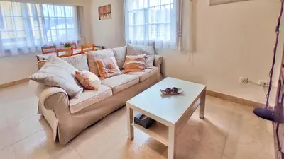 a living room with a couch and a table at Apartamento con wifi en casco histórico Betanzos in Betanzos