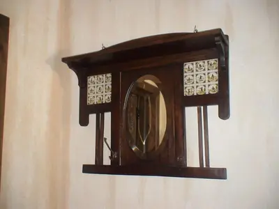 a wooden mirror on a wall on a wall at Casa del Cura in Rozas