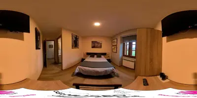 a bedroom with two beds in a room at Casa-Museo Genia Trigo in Sober