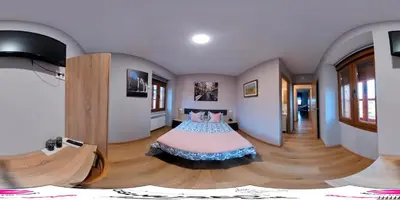 a bedroom with a bed in the middle of a room at Casa-Museo Genia Trigo in Sober