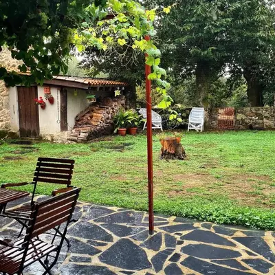 a sign in front of a house with a cow at Casas Quo Vadis -Azul in Lugo