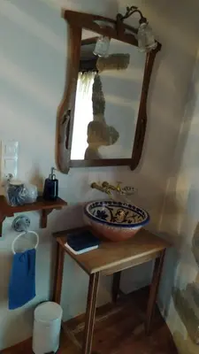 a bathroom with a sink and a mirror at Casas Quo Vadis -Azul in Lugo
