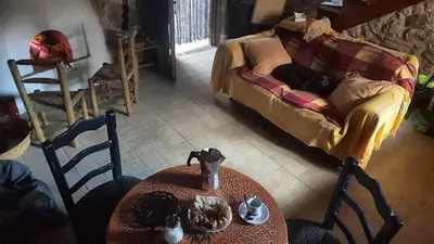 a living room with a table and a couch at Casas Quo Vadis -Azul in Lugo