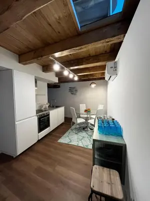 a kitchen and dining room with a table and chairs at HOTEL CASAS DA FORTALEZA Casa da Torre in Outeiro de Rei