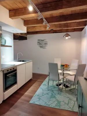 a kitchen and dining room with a table and chairs at HOTEL CASAS DA FORTALEZA Casa da Torre in Outeiro de Rei