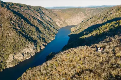 an aerial view of a river in the mountains at Casa Sancristán. in Sober