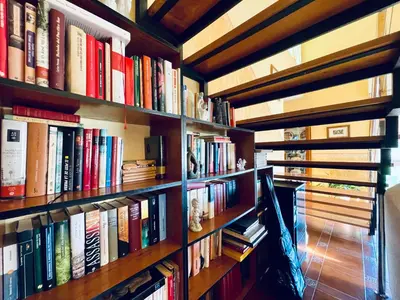 a book shelf filled with lots of books at O Souto de Monteasnal in Ourense