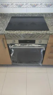 a stove top oven sitting on top of a counter at Ciudad De Sada in Sada