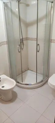 a bathroom with a shower and a toilet at Ciudad De Sada in Sada