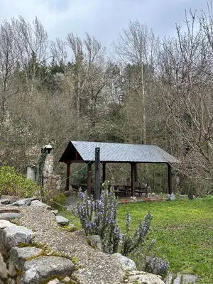 a gazebo in the middle of a field at Casa Begoña in Igüeña