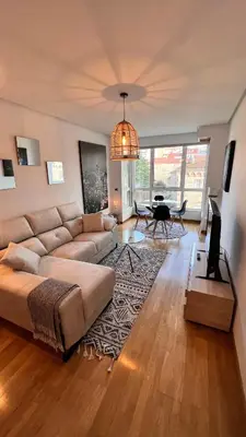 a living room with a couch and a table at Apartamentos San Martin Ourense Centro 2 in Ourense