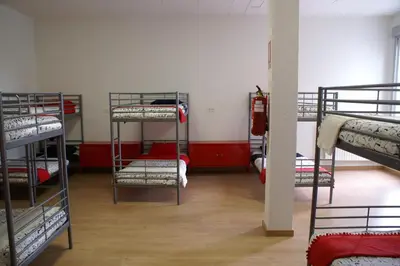 a room with a bunch of bunk beds at Grelo Hostel in Ourense