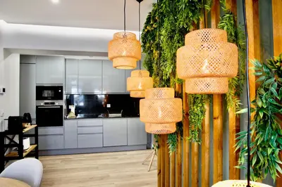 a kitchen with several lights hanging from a wall at Cathedral Boutique by Lugo Collection in Lugo