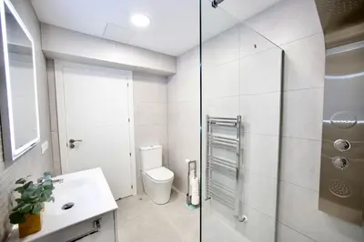 a bathroom with a toilet and a sink at Cathedral Boutique by Lugo Collection in Lugo