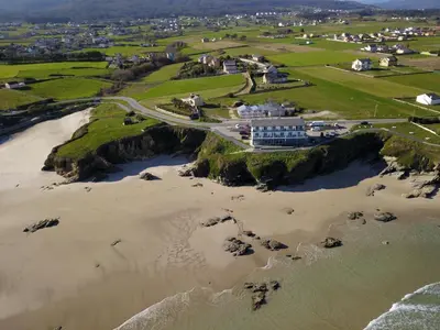 an aerial view of a beach and the ocean at Refugio O Castro in Barreiros