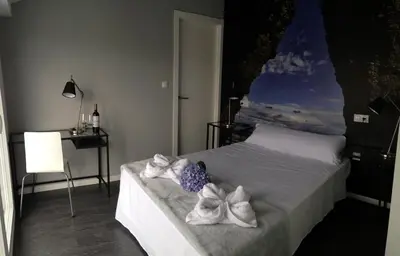 a bedroom with a bed with towels on it at Refugio O Castro in Barreiros