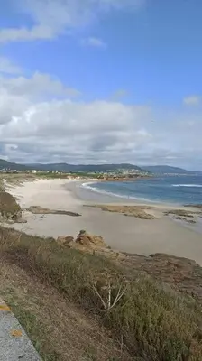 a view of a beach with the ocean at El apartamento de Ana y Mariano in Foz