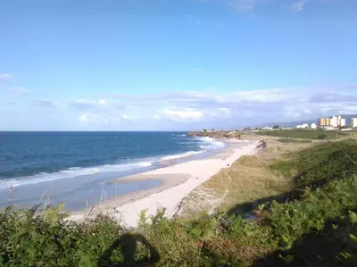 a view of a beach with the ocean at El apartamento de Ana y Mariano in Foz
