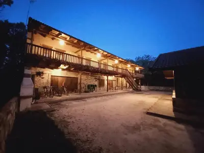 a building with lights on the side of it at Apartamentos turísticos LAS CARBALLEDAS in Rabanal del Camino