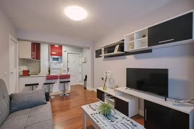 a living room with a large flat screen tv at Apartamento de Julia in Santiago de Compostela
