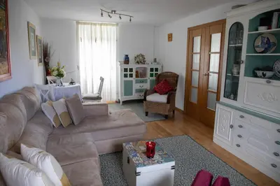 a living room with a couch and a table at Casa San Martiño - Teo in Rua De Francos