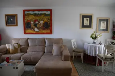 a living room with a couch and a table at Casa San Martiño - Teo in Rua De Francos