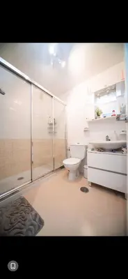 a bathroom with a shower and a toilet and a sink at Piso Milà in Ourense