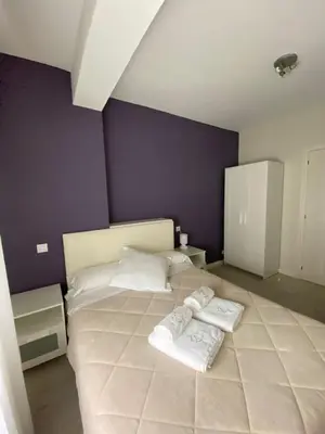 a bedroom with two white towels on a bed at Pensión NAVIA A Pontenova in A Pontenova
