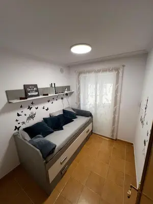 a bedroom with a bed with birds on the wall at MANSIÓN DEL INDIANO in Viveiro