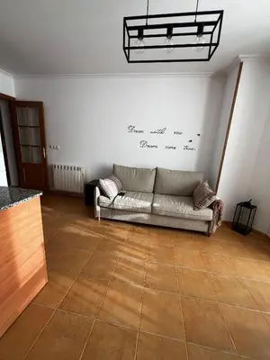 a living room with a couch on the wall at MANSIÓN DEL INDIANO in Viveiro