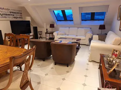 a living room with a couch and a table at Piso Premium en Casco Histórico Vistas a la Ría Parking in Viveiro