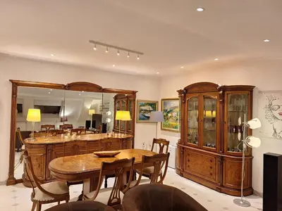 a dining room with a table and a mirror at Piso Premium en Casco Histórico Vistas a la Ría Parking in Viveiro