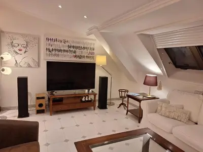 a living room with a flat screen tv and a couch at Piso Premium en Casco Histórico Vistas a la Ría Parking in Viveiro
