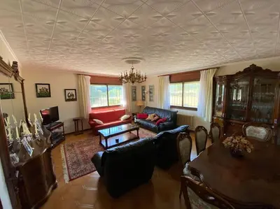 a living room with a couch and a table at Casa Vilachá - Ribeira Sacra in Puebla del Brollón