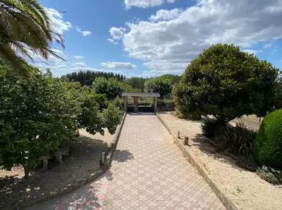 a walkway leading to a pavilion in a park at Casa Vilachá - Ribeira Sacra in Puebla del Brollón