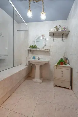 a bathroom with a sink and a shower and a mirror at YourHouse A Casa Dos Cregos in Fonteita