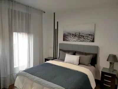 a bedroom with a large bed and a window at Piso turistico el Sol VUT-983 in Astorga