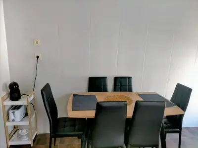 a dining room table with black chairs around it at Piso turistico el Sol VUT-983 in Astorga