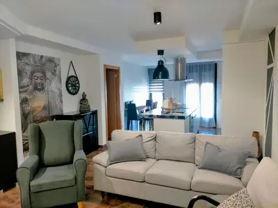 a living room with a white couch and two chairs at Piso turistico el Sol VUT-983 in Astorga