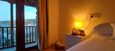 a bedroom with a bed and a window with a balcony at la solana del abuelo Andrés in La Chana