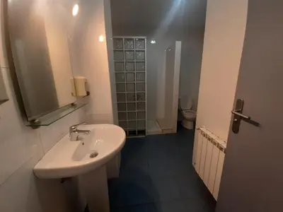 a bathroom with a sink and a toilet at Albergue Berce do Camiño in Tríacastela
