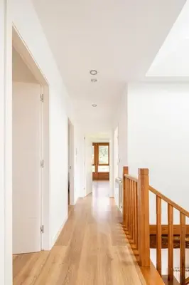 a hallway of a house with white walls and wooden floors at Casa Taboada in San Román
