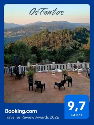 a house with a wooden gate and a patio at Os Fentos in Pontevedra