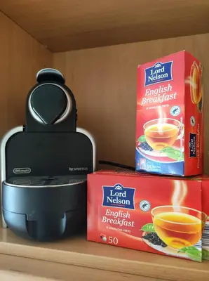 a pot of tea and a box of food on a shelf at Val de Lemos in Monforte de Lemos