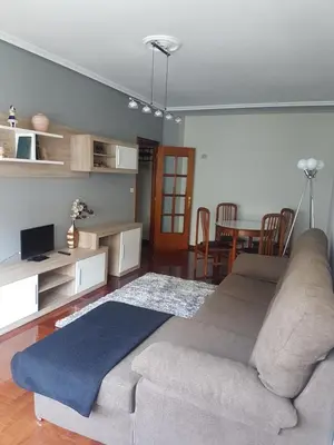 a living room with a couch and a table at El Descanso de Ana in Ourense
