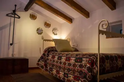 a bedroom with a bed in a room at Casa Dona Ildara in Doade
